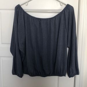 Blue over shoulder cropped top.